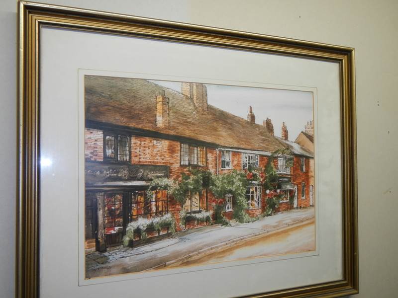 A framed and glazed print depicting a village pub. COLLECT ONLY.