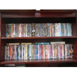 Two shelves of assorted DVD's.