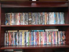 Two shelves of assorted DVD's.