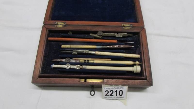 A cased part geometry set with bone handles.