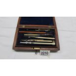 A cased part geometry set with bone handles.