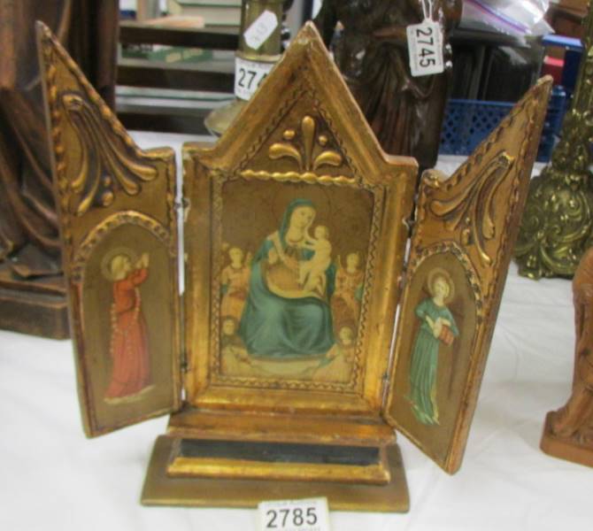 A late 19th-century gilded wooden tryptich icon.