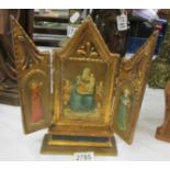 A late 19th-century gilded wooden tryptich icon.