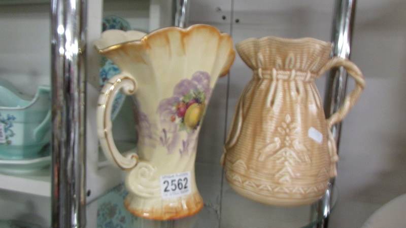 An Arthur Wood jug and a Falcon ware jug.
