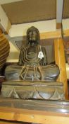 A carved wood Buddha. 48 cm tall.