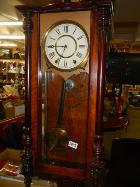 A mahogany Vienna wall clock in working order. COLLECT ONLY.