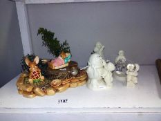 A Pendelfin stand, 2 Pendelfins & 4 snow baby figures (1 musical)