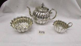 A pretty three piece silver plate tea set.