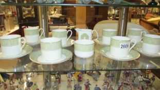 Eight Royal Doulton tea cups and saucers with sugar bowl and milk jug. COLLECT ONLY.