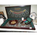 A 'Gamble at Home' games set comprising Black Jack, Roulette etc.,