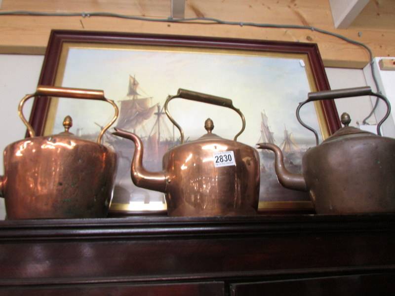 Three Victorian copper kettles.
