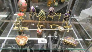 A collection of Faberge' style egg pill boxes etc.,