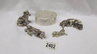 Two metal dogs, a metal fox, a donkey and a silver plate ring box.