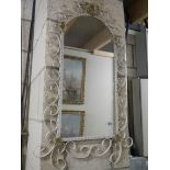 A wrought iron arched top mirror. COLLECT ONLY.