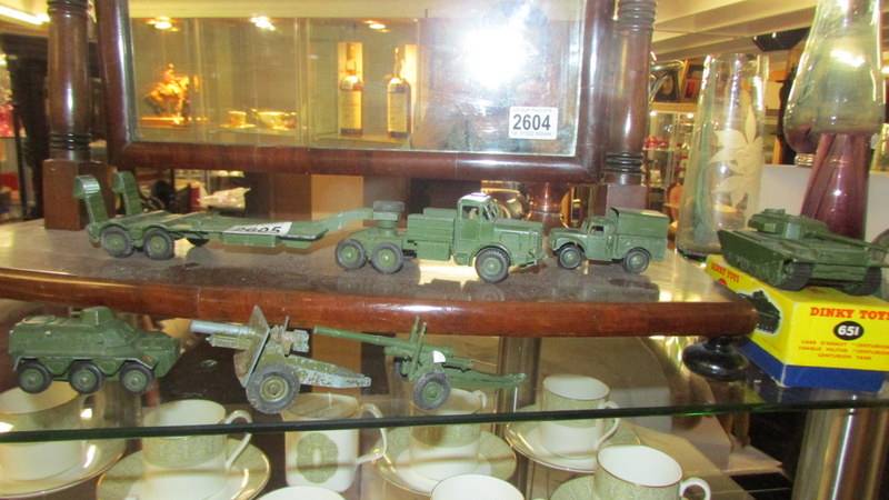 A boxed Dinky 651 centurion tank and other military vehicles.