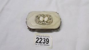 A 19th century carved ivory and white metal card case.