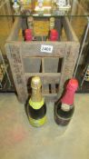 A wooden case with six bottles of sparkling wine, including 1955 dry Imperial, Moet et Chandon