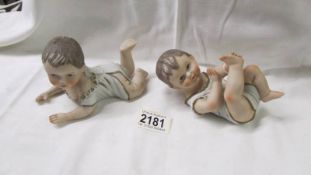 Two Victorian bisque porcelain piano babies.