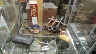 A collection of old pipes including a pair of silver mounted pipes etc.,