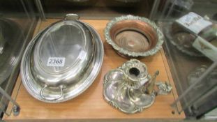 A silver plate tureen, wine coaster and chamber candlestick.