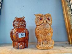 A pottery owl money box and an owl figure height 20.5cm and 22.5cm