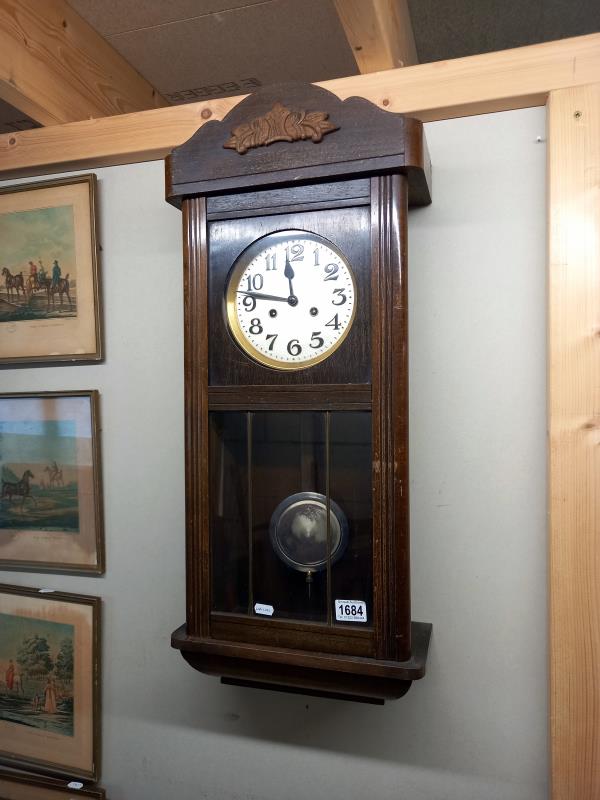 An 8 day mahogany wall clock with pendulum, 78 cm high, COLLECT ONLY.