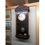 An 8 day mahogany wall clock with pendulum, 78 cm high, COLLECT ONLY.