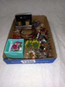 A box of costume jewellery including bracelets, brooches & cufflinks etc.