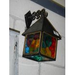A coloured outdoor lantern.