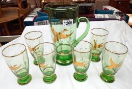 A vintage green glass juice/drinks set gold overlaid with ducks in flight, made in Germany COLLECT