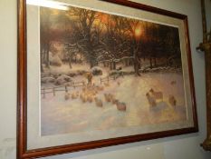 A framed and glazed print of a winter scene with sheep. COLLECT ONLY.