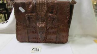 A vintage crocodile hand bag.