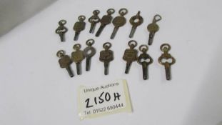 A selection of good named pocket watch keys, 14 in total.