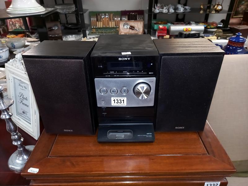 A Sony mini HiFi system, tuner & CD player with docking port, untested