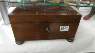 A mahogany work box in good condition.