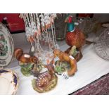 A porcelain deer, red fox & red squirrel together with a pheasant