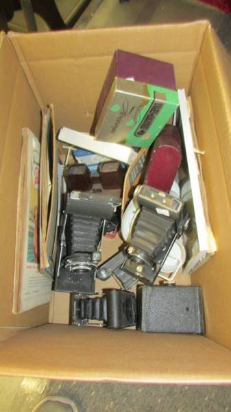 A box of old camera's including folding examples.