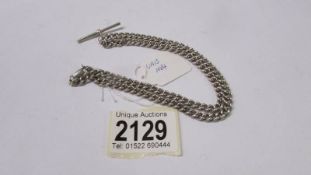 A silver curb chain with vintage T bar.