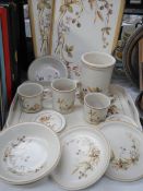 A mixed lot of mugs, plates etc., and four trays. COLLECT ONLY.
