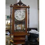A good quality mahogany inlaid wall clock in good condition but missing pendulum, COLLECT ONLY.