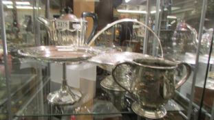 A silver plate teapot, comport, basket and two handled pot.