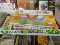 Two boxed flying bird kites and a 9 hole golf set.
