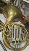 A rare rotary valve French Horn marked Alliance, La Fleur, has some dints but in good working order.