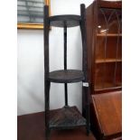 A carved black oak oriental 3 tier stand COLLECT ONLY.