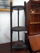 A carved black oak oriental 3 tier stand COLLECT ONLY.