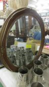 A circular framed bevel edged mirror. COLLECT ONLY.