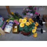 A quantity of pottery plant pots and planters including brass with a selection of artificial