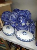 A large lot of Spode dinnerware and a pair of Hanley blue and white lidded tureens