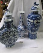 Two early Chinese blue and white lidded vases, another vase and a flask, all a/f.