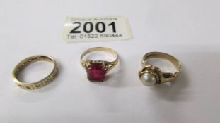 Three 9ct gold rings, approximately 8.9 grams.